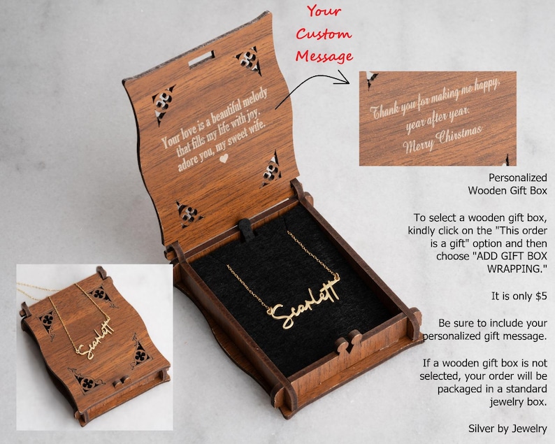 May include: A wooden gift box with a gold-colored necklace inside. The box is open, revealing a black interior and the necklace with the name "Scarlett". The box has decorative cutouts and text that reads "Your love is a beautiful melody..."