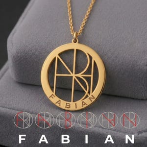 May include: A gold-toned circular pendant necklace featuring a cut-out monogram design of the letters F, A, B, I, A, and N arranged in a geometric pattern. The name FABIAN is engraved in capital letters along the bottom edge of the circular frame.