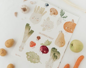 May include: A colorful illustrated seasonal calendar featuring various fruits and vegetables with cute faces. The calendar is printed on white paper and includes German text, "Saisonkalender".