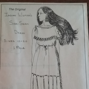 May include: A black and white line drawing of a woman wearing a long dress with fringe detailing. The text "The Original Indian Woman's Side-Seam Dress Sizes 10-20 1 Piece" is written on the page.
