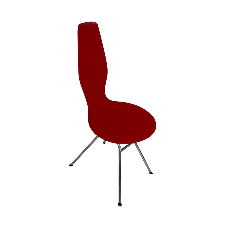 May include: A red chair with a unique, curved back and a chrome frame. The chair has a modern design and is perfect for a dining room or living room.