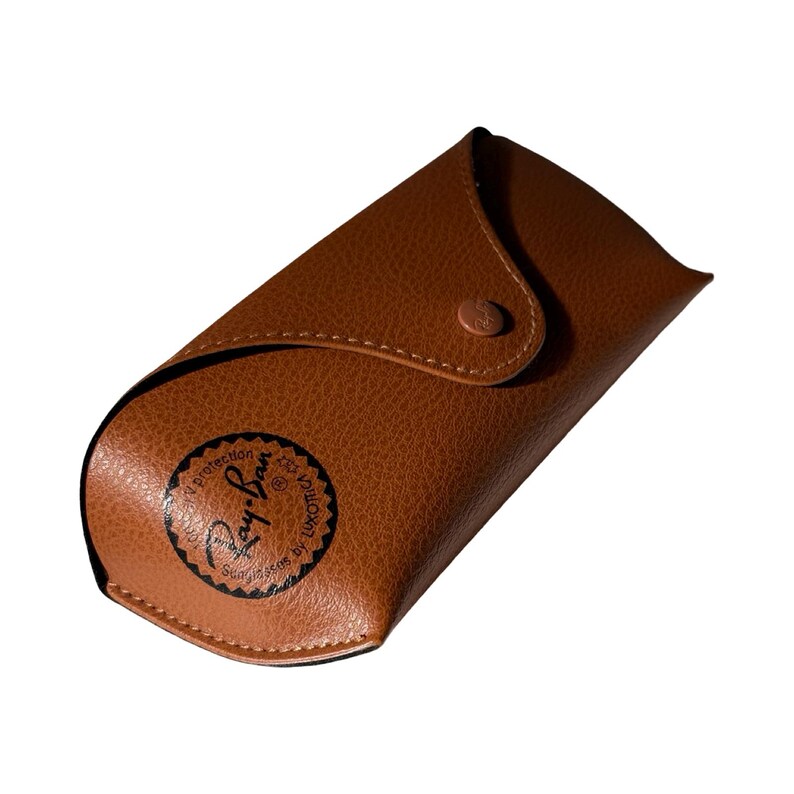 May include: A brown leather eyeglass case with a snap closure. The case has a rounded shape and features the Ray-Ban logo in black on the front. The case is designed to protect sunglasses.