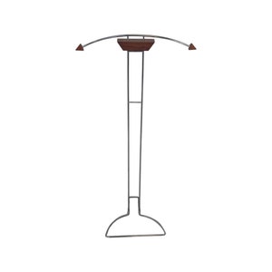 May include: A chrome-plated metal coat rack with a curved top and a wooden shelf. The rack has a wide base for stability.