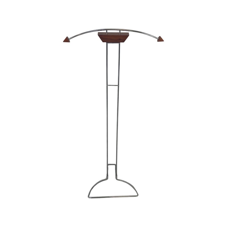 May include: A chrome-plated metal coat rack with a curved top and a wooden shelf. The rack has a wide base for stability.
