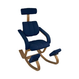 May include: A blue rocking kneeling chair with a headrest and footrest. The chair is made of wood and fabric.
