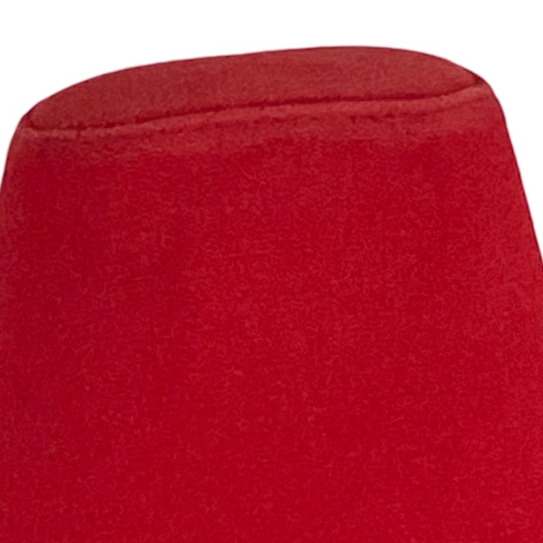 May include: A solid red fez hat with a smooth, slightly textured surface.