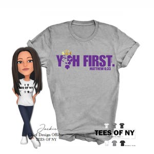 May include: Gray t-shirt with purple text that reads "YOH FIRST. MATTHEW 6:33". The text is in a bold, blocky font. A gold crown and a purple silhouette of a face are above the text.