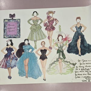 May include: Illustration of vintage fashion designs, featuring various gowns and dresses in a range of colors. A perfume bottle illustration is also present. Handwritten text is visible in the lower right corner.