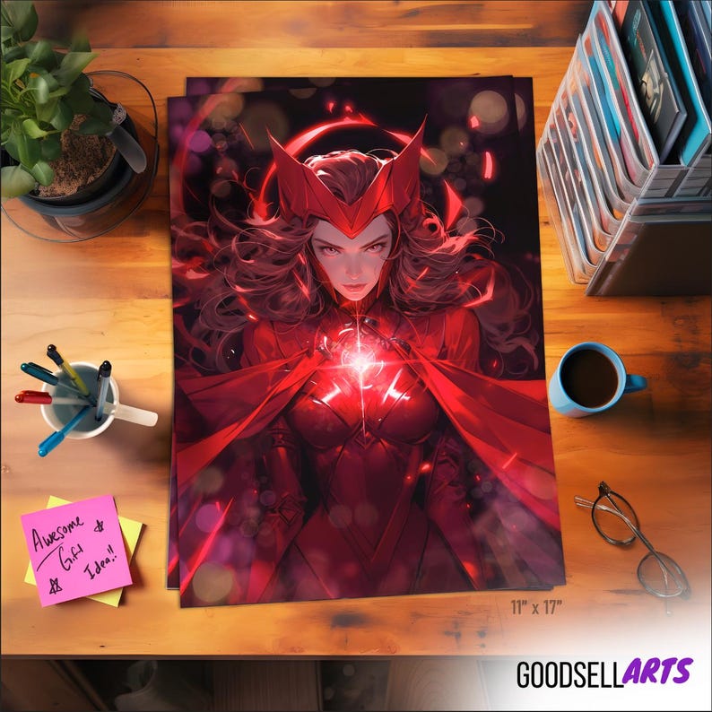 May include: A vibrant red art print featuring a female character with long, flowing hair and a red costume. The print is 11 x 17 inches and has a bright, glowing center. The print is on a wooden desk with a coffee cup and pens.