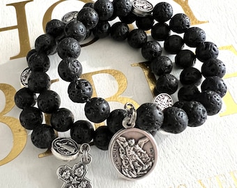 Lava Stone Rosary Bracelet w/Stainless Steel Memory Wire. Four Way Cross. St. Benedict Metal Our Father Beads. Choice of St. Medal.