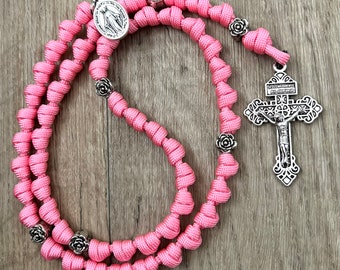 Rose Pink Pardon Crucifix Catholic Rosary Rope. Metal Alloy Rose Shape Our Father Beads. Your choice of Saint Medal (550 Paracord)