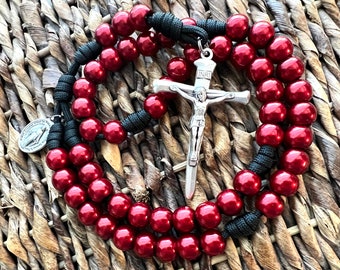 Deep Red Gloss Catholic Rosary. ABS Plastic 12mm Beads. Large Nailed Crucifix. Your choice of Saint medal. Black #550 Paracord.