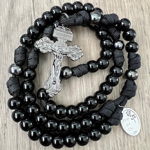 Black & Gunmetal Pardon CrucifIx Catholic Rosary. 10mm Acrylic Beads. Metal Our Father Beads. Your choice of Saint Medal. #550 Paracord.