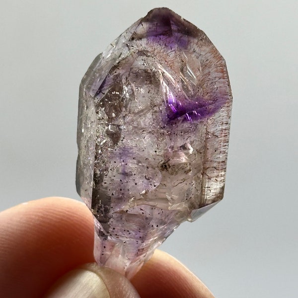 Smoky amethyst enhydro quartz scepter with hematite inclusions