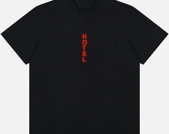 May include: Black t-shirt with a red vertical "HOTEL" graphic.
