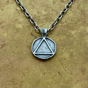 Collana in argento sterling con elementi fuoco e acqua: pendente fuso in sabbia a due lati