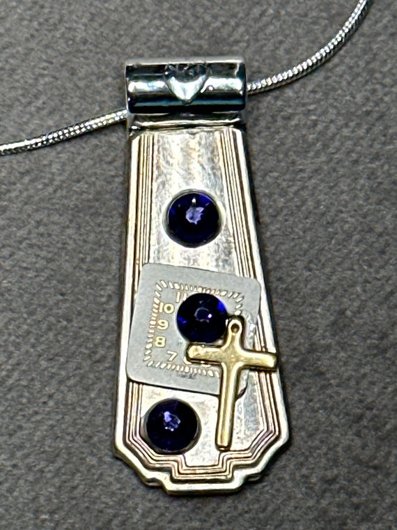 Cross and purple crystals on watch face spoon necklace