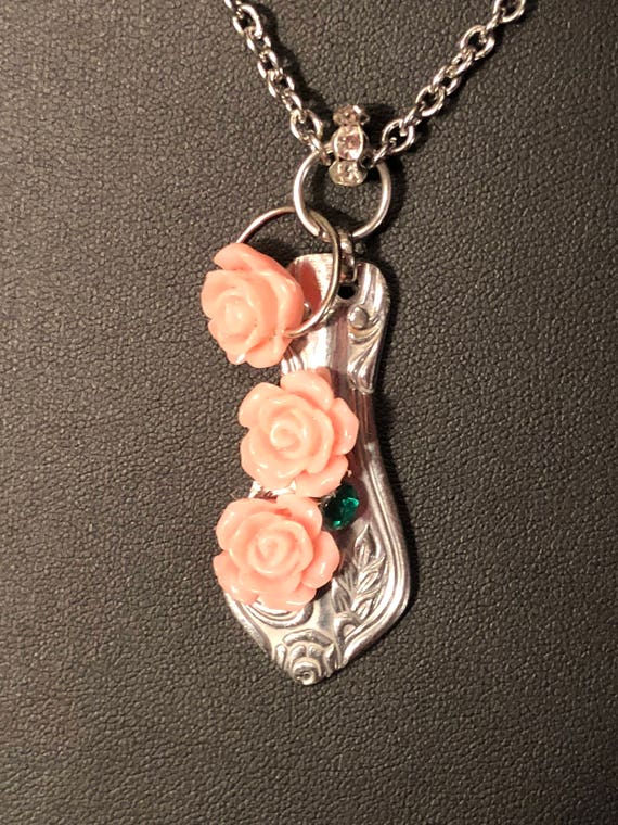 Spoon pendant with pink roses, green and clear crystals with pink rose dangle on stainless steel.