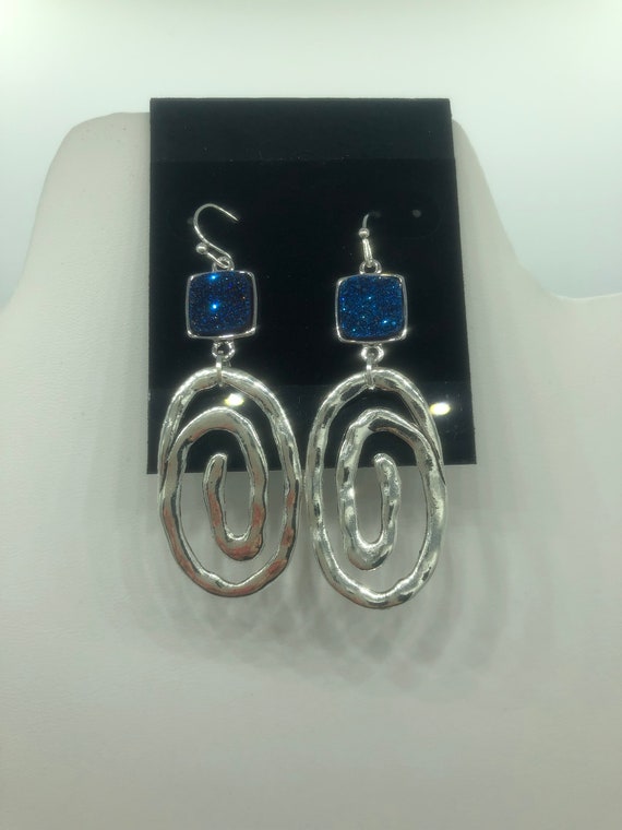 Handmade and recycled silver metal earrings on a French ear wire with blue druzy stones