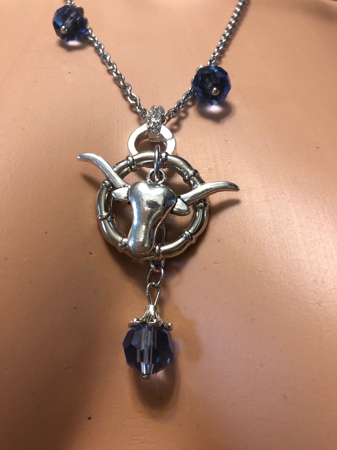 Handmade silver metal longhorn pendant with blue crystals necklace