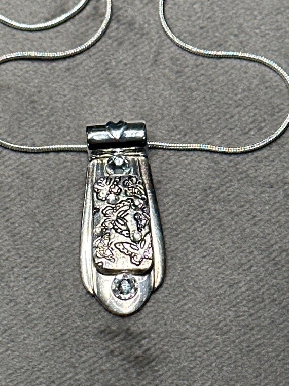 Clear crystals and patterned spoon necklace
