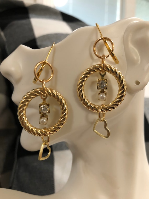 Golden twisted circle with pearl, crystal and heart dangle earrings