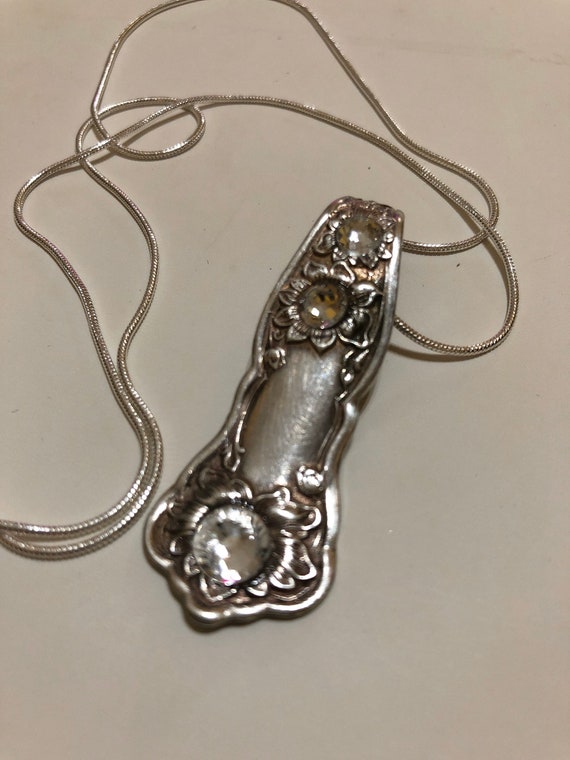 Orange Blossom pattern spoon handle pendant with clear crystals on snake chain