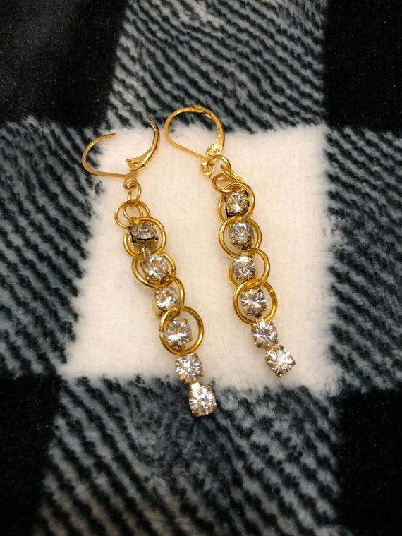 Handmade golden rings and crystals earrings