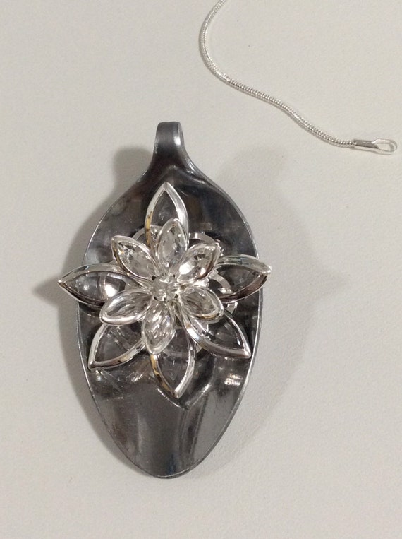 Handmade pendant from spoon and clear flower