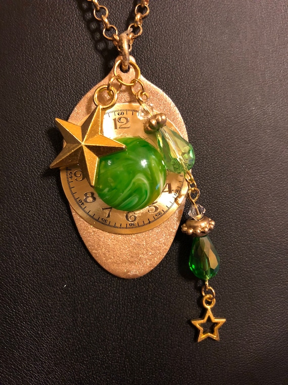 Recycled golden painted spoon necklace with watch face, green resin and glass stones with star and stone dangle