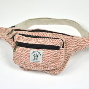 May include: A red and white hemp fanny pack with a zipped pocket and a label that reads "Himalayan Hemp THC Free Made in Nepal".