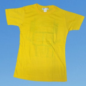 May include: A bright yellow t-shirt with a short sleeve and a crew neck.