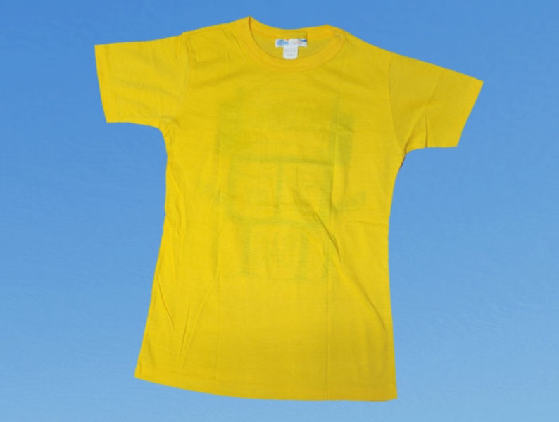 May include: A bright yellow t-shirt with a short sleeve and a crew neck.