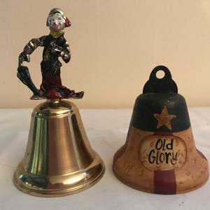 Hand Bells Lot of 2 Metal Hand Bells (Clown and Patriotic Bell)