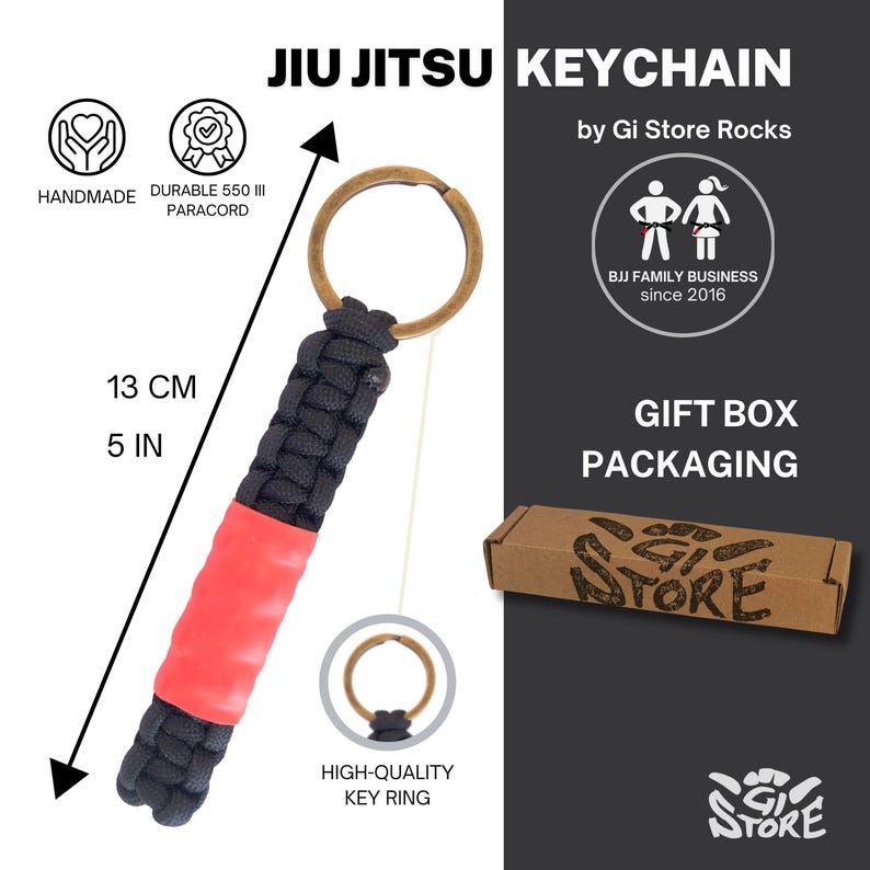 May include: A black and red paracord keychain with a bronze-colored metal ring. The keychain measures 5 inches in length. Text on the image includes JIU JITSU KEYCHAIN, by Gi Store Rocks, BJJ FAMILY BUSINESS since 2016, and GIFT BOX PACKAGING.