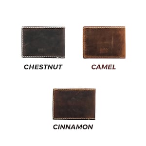 May include: Three leather wallets in different colors: chestnut, camel, and cinnamon. Each wallet has a stitched edge and the Lone Fox Leather Co. logo.