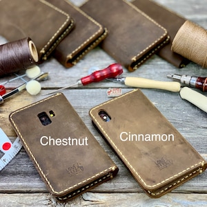 May include: Leather phone cases in chestnut and cinnamon colors with white stitching. The cases are shown with leather working tools and spools of thread. The text "Chestnut" and "Cinnamon" are visible on the cases.