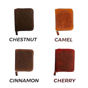 May include: Four leather wallets in different colors: chestnut, camel, cinnamon, and cherry. Each wallet has a zipper closure.