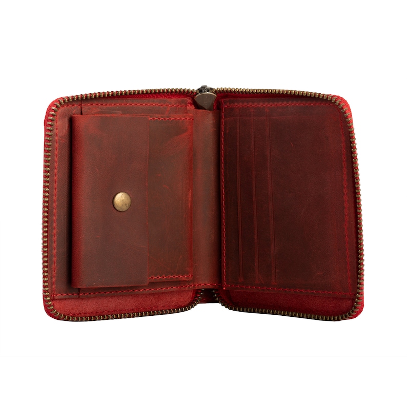 May include: Red leather zippered wallet with a small interior pocket and multiple card slots.