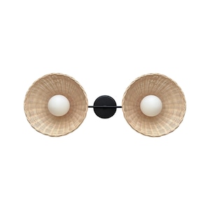 May include: A black metal wall sconce with two woven wicker shades and white globe light bulbs.