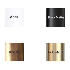 May include: Four color swatches showing different finishes for a product. The swatches are labeled "White", "Black Matte", "Bronze", and "Gold Matte".