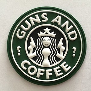 May include: Green and white round sticker with the text "Guns and Coffee" and a stylized image of a mermaid holding two guns.