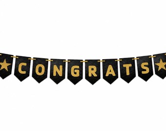 May include: A decorative banner featuring black pennant-shaped flags strung on a gold cord. Each flag displays a gold letter or star, spelling out the word CONGRATS with a star at each end. The letters and stars have a textured, glittery finish.