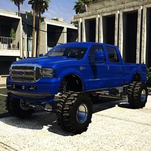 Puede incluir: Una camioneta Ford azul levantada con neumáticos de gran tamaño está estacionada sobre una superficie de hormigón. La camioneta está frente a un edificio con grandes ventanas y palmeras. La camioneta tiene un parachoques delantero y espejos laterales cromados.