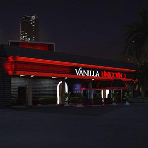 Puede incluir: Toma exterior nocturna de un edificio con luces de neón rojas. El letrero dice "Vanilla Unicorn" en letras blancas. Un logotipo de neón rojo está a la izquierda. El edificio tiene una fachada de ladrillo oscuro.