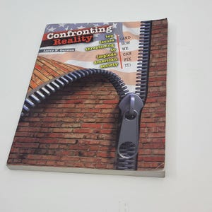 May include: A book titled "Confronting Reality" with a brick wall and zipper design. The cover includes text about issues threatening American society. The author's name is Larry N. Gerston.