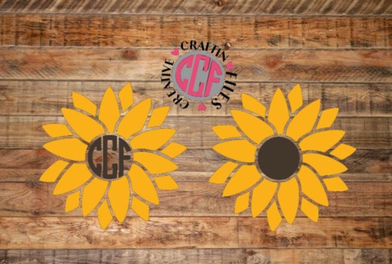 May include: Two yellow sunflower designs with brown centers. One sunflower has the letters "CCF" in the center. The other sunflower has a solid brown center. The text "Creative Crafting Files" is in a circle around the sunflower with the letters "CCF".