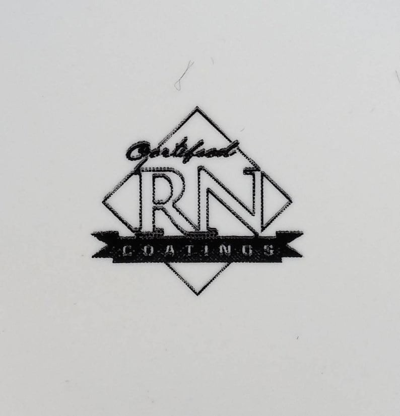 May include: A black and white logo on a white background. The logo features the letters "RN" inside a diamond shape, with the word "Coatings" below. Above the diamond is the word "Certified".