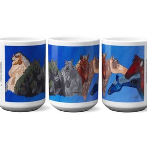 May include: White ceramic mug featuring a colorful painting of several horses against a blue background. The artwork includes horses in various colors, including brown, gray, and blue. The mug has a large handle and is suitable for hot or cold beverages.