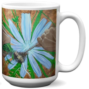 May include: White ceramic mug with a detailed illustration of a large blue flower with green leaves and brown accents. The artwork includes a root system and is set against a brown background. The mug has a white handle.